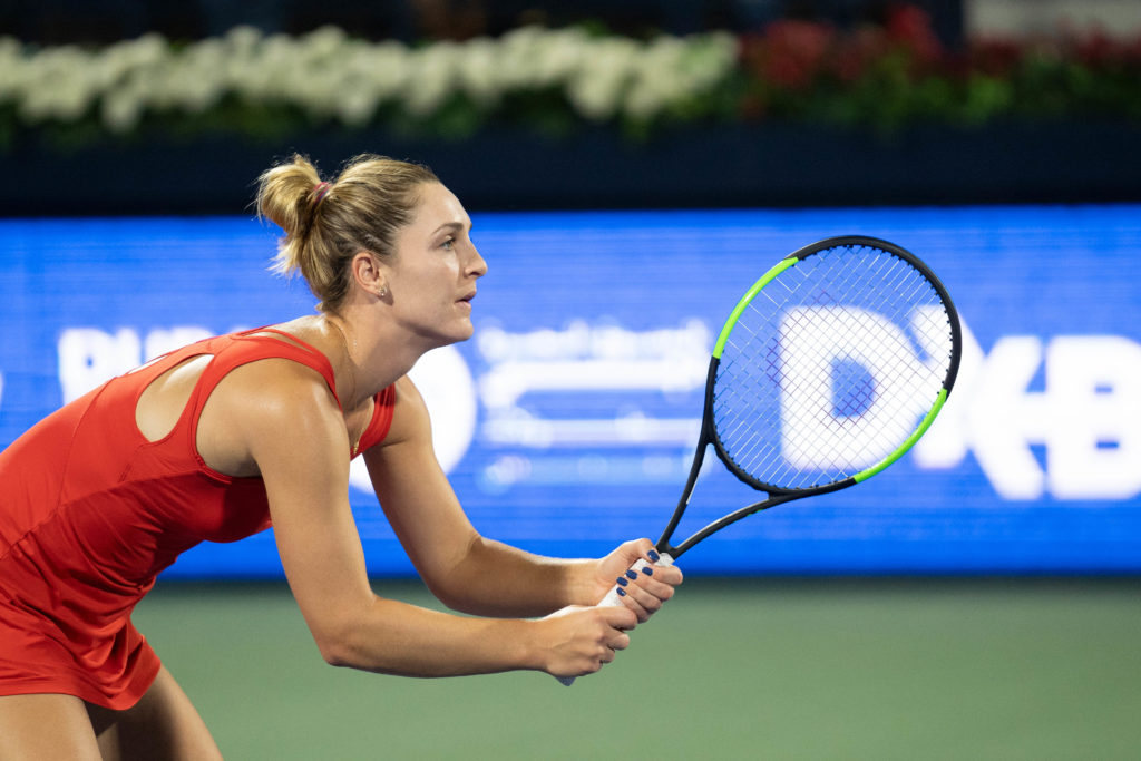 gabrielle dubrowski holding tennis racket, waiting for a serve