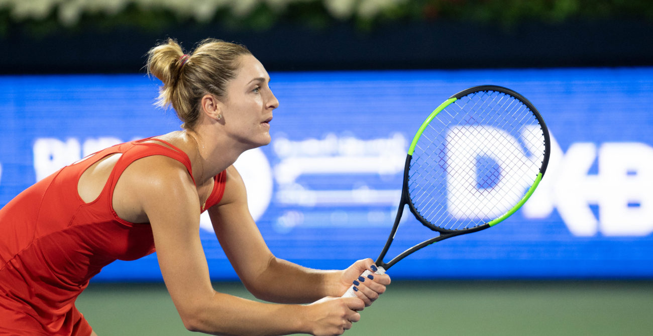 gabrielle dubrowski holding tennis racket, waiting for a serve