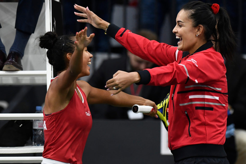 Leylah goes for a hug with Billie Jean Cup Captain Heidi El Tabakh