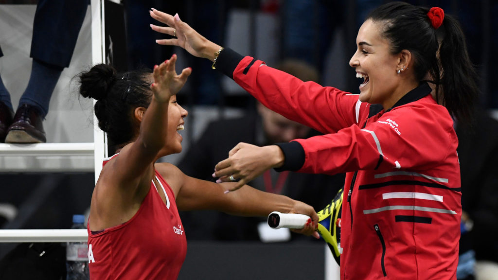 Leylah goes for a hug with Billie Jean Cup Captain Heidi El Tabakh