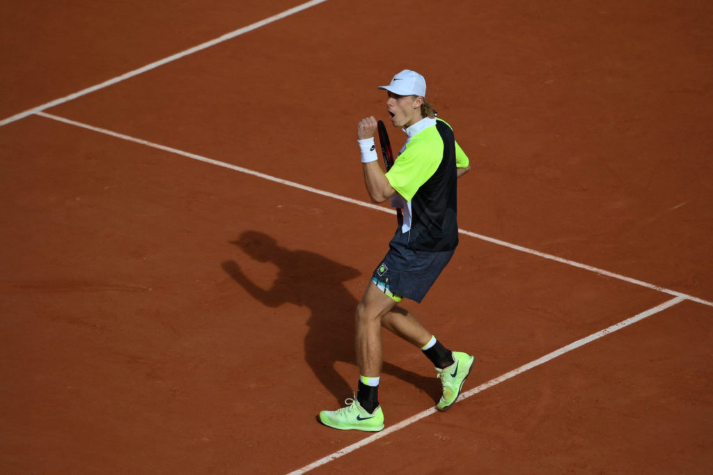 Shapovalov fist pumps, on a clay court