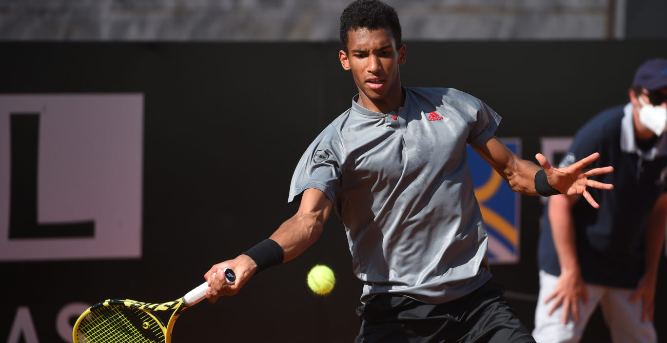 Felix Auger-Aliassime hits a forehand