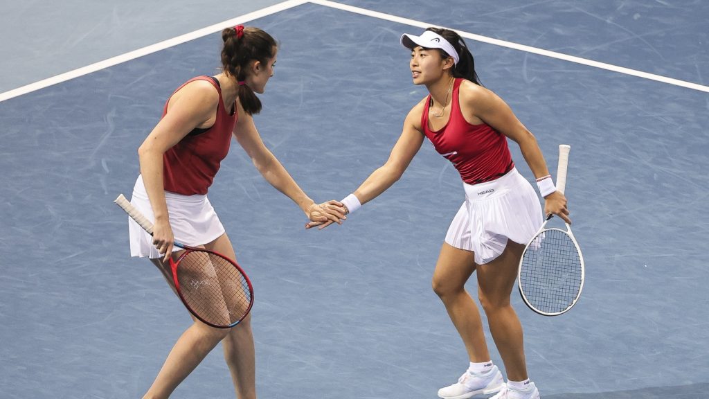 Rebecca Marino and Carol Zhao encourage each other during the billie jean king doubles match