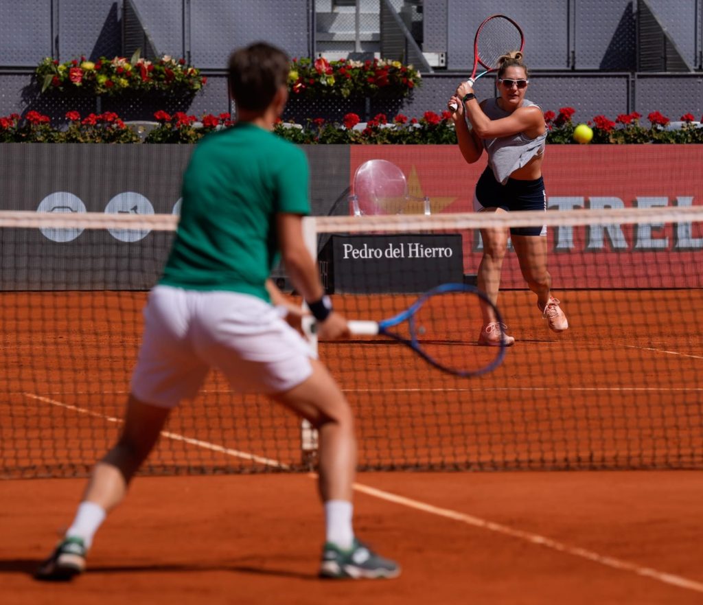 Dabrowski practices her backhand on clay