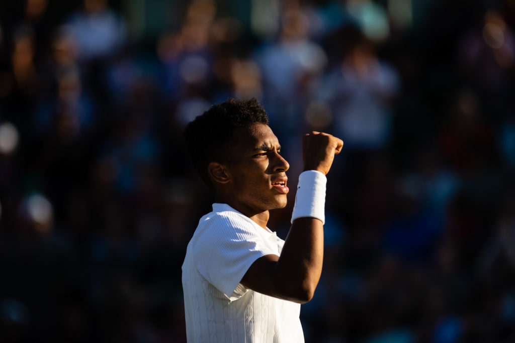 Felix Auger Aliassime raises his fist after a win at Wimbledon