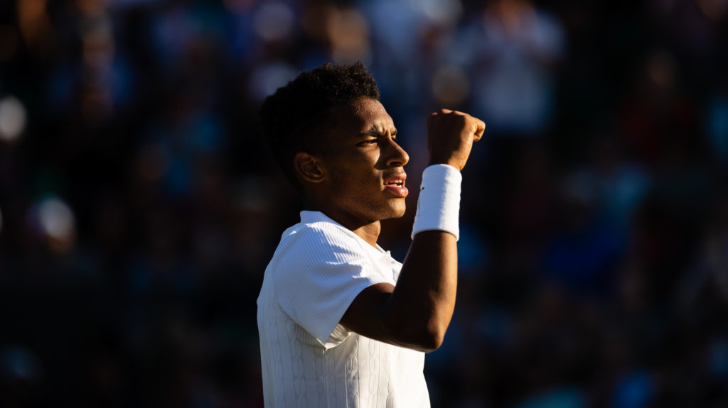 Felix Auger Aliassime raises his fist after a win at Wimbledon