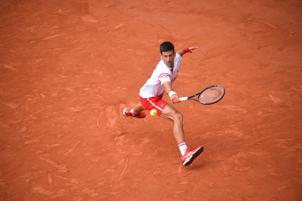 Djokovic hits a running backhand slice