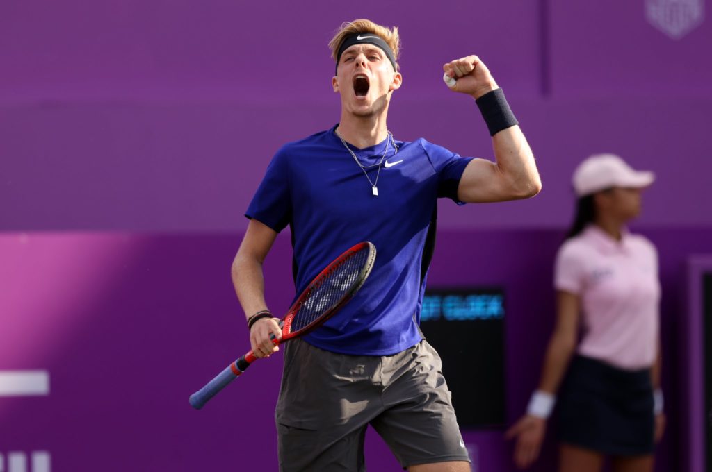 Shapovalov jumps in the air in celebration