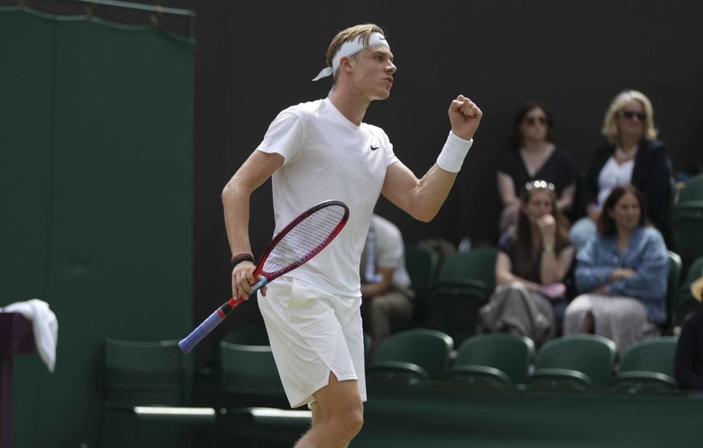 Denis Shapovalov pumps his fist at Wimbledon