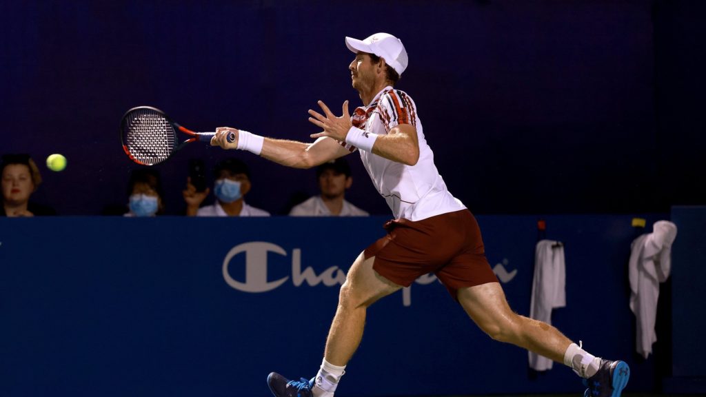 Andy Murray hits a forehand on the run
