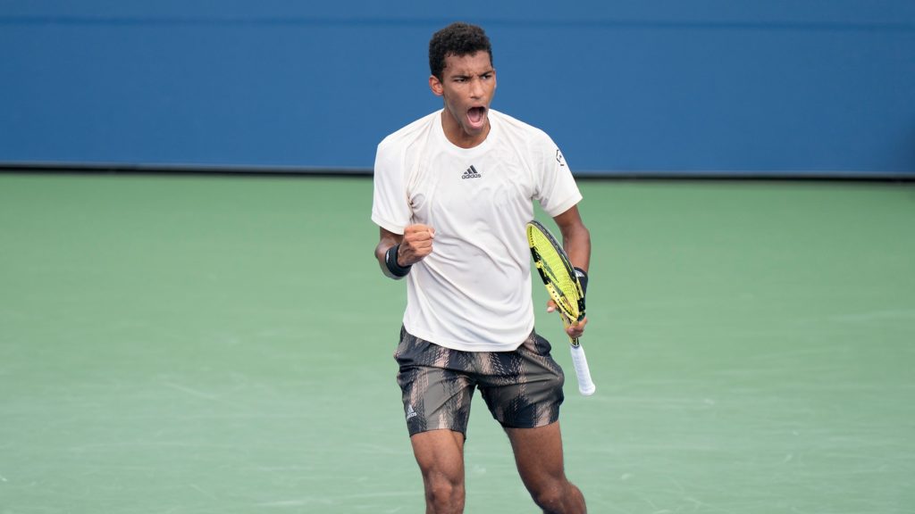 felix auger-aliassime fist pumps after win