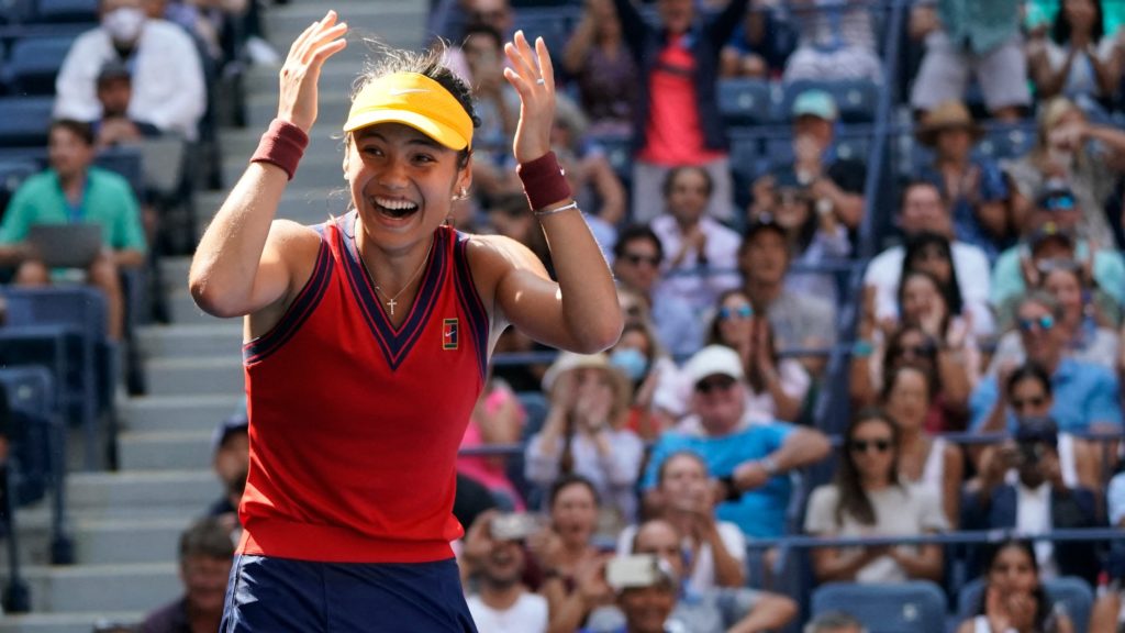 Emma Raducanu of the UK smiles and lifts her hands to her head
