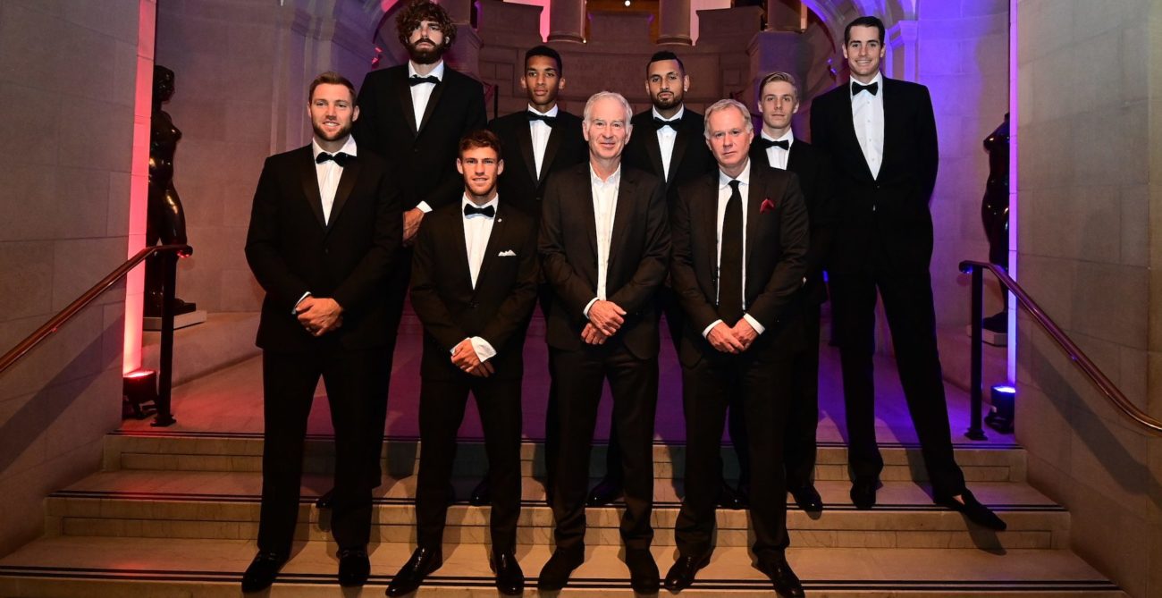 Tennis players in suits posing as a group