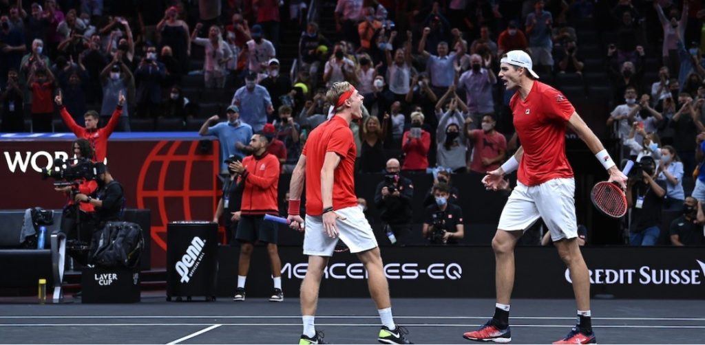 Danis Shapovalov and John Isner celebrate a win