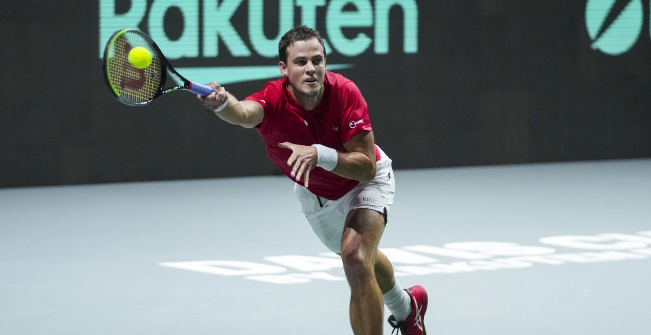 Vasek Pospisil lunges for a forehand.