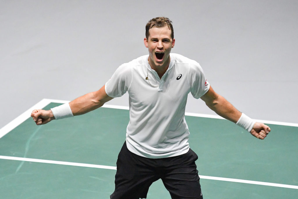 Vasek Pospisil celebrates a win on court.