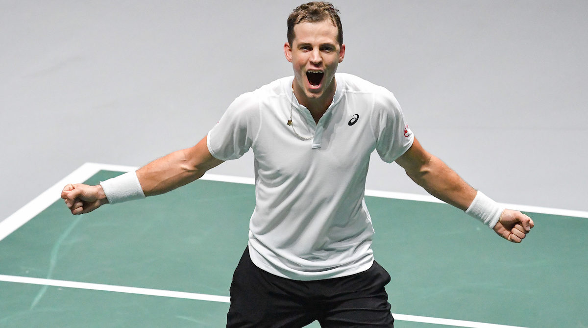 Vasek Pospisil celebrates a win on court.