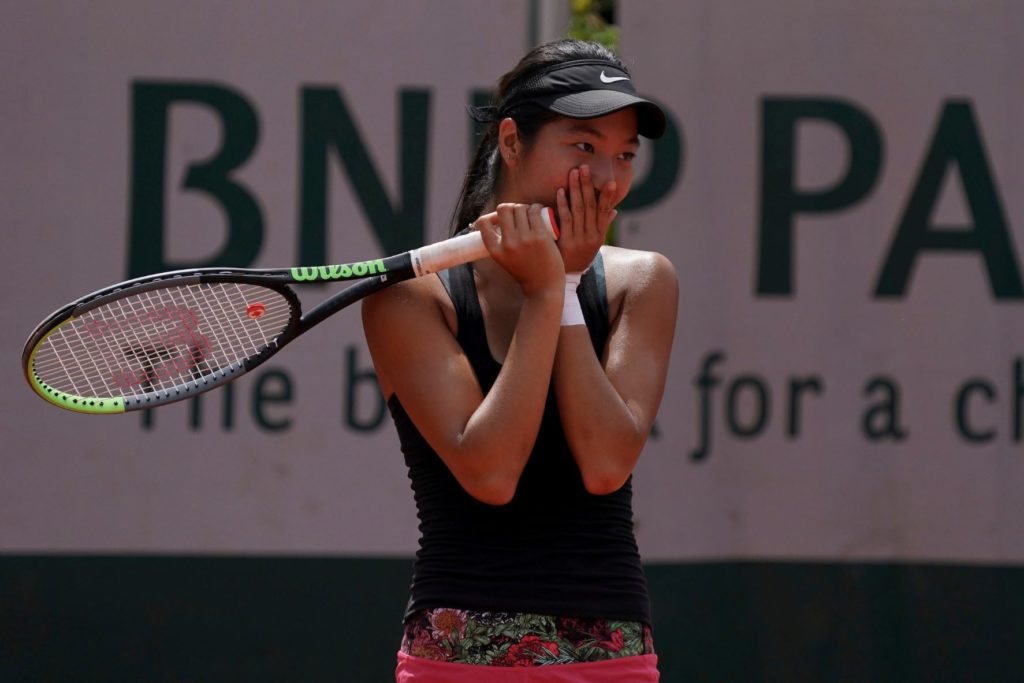 Anabelle Xu puts her hands over her mouth and looks to her left