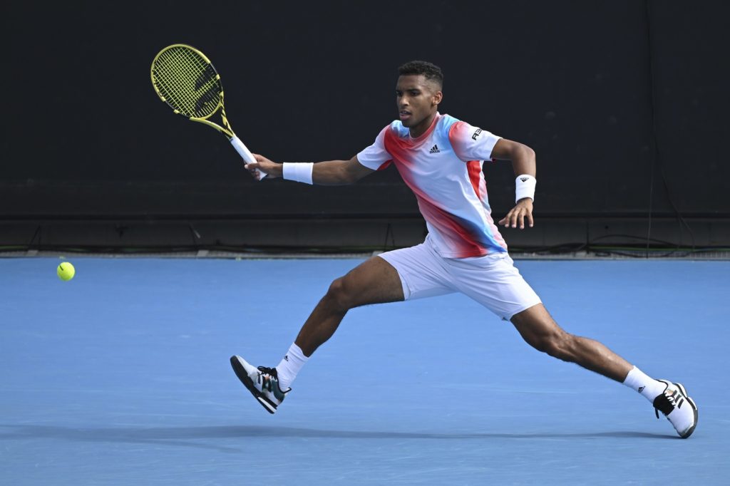Felix Auger-Aliassime hits forehand at 2022 Australian Open