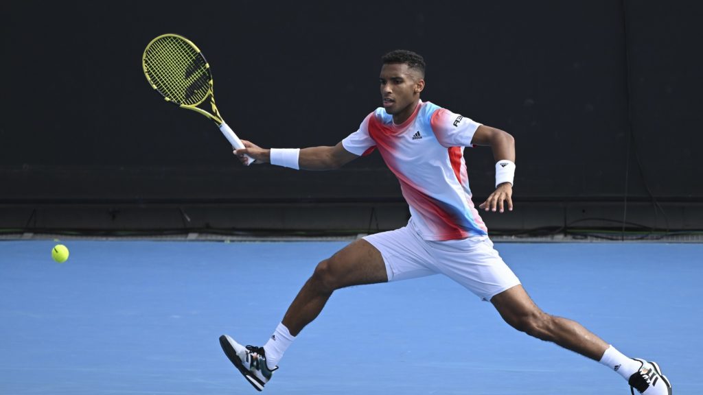 Felix Auger-Aliassime hits forehand at 2022 Australian Open