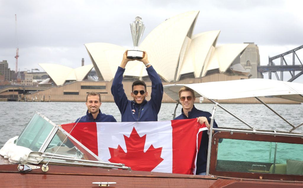 denis shapovalov felix auger-aliassime steven diez on boat with flag and trophy atp cup in sydney