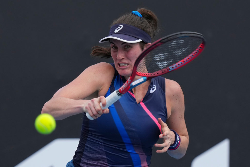 Rebecca Marino follows through on a forehand.