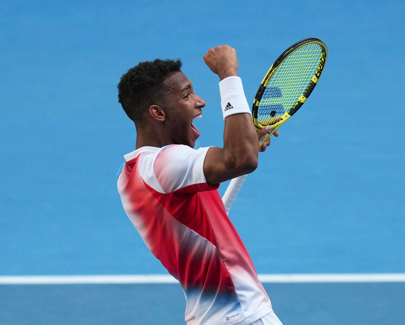 Félix Auger-Aliassime pumps his fist.