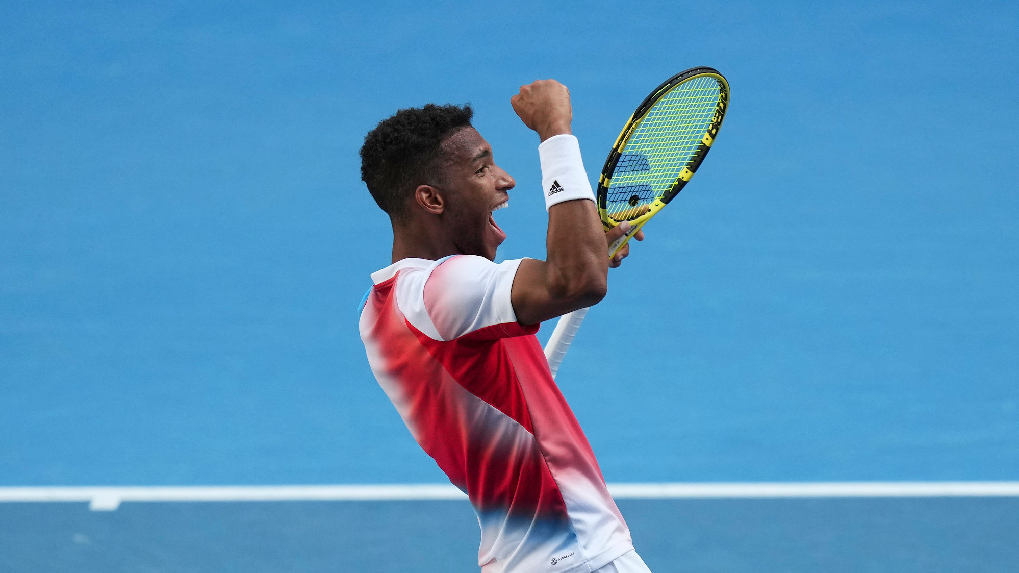 Félix Auger-Aliassime pumps his fist.
