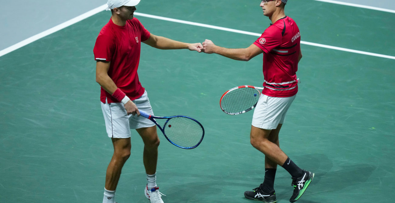 Brayden Schur and Peter Polansky fist bump.