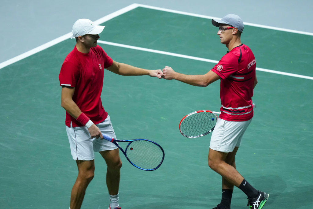 Brayden Schnur and Peter Polansky fist bump.