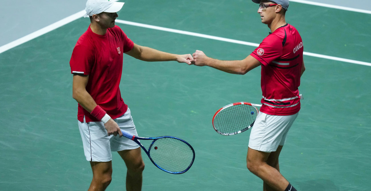 Brayden Schnur and Peter Polansky fist bump.