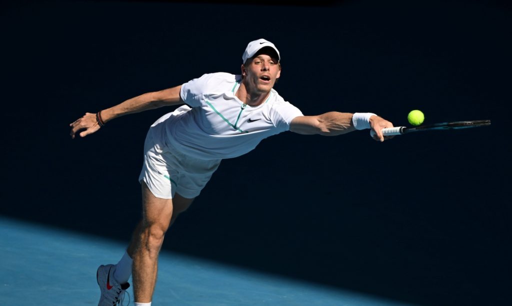 Denis Shapovalov lunges for a forehand.