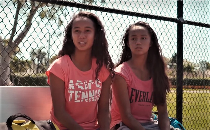 Leylah and Bianca Fernandez sitting next to each other outdoors