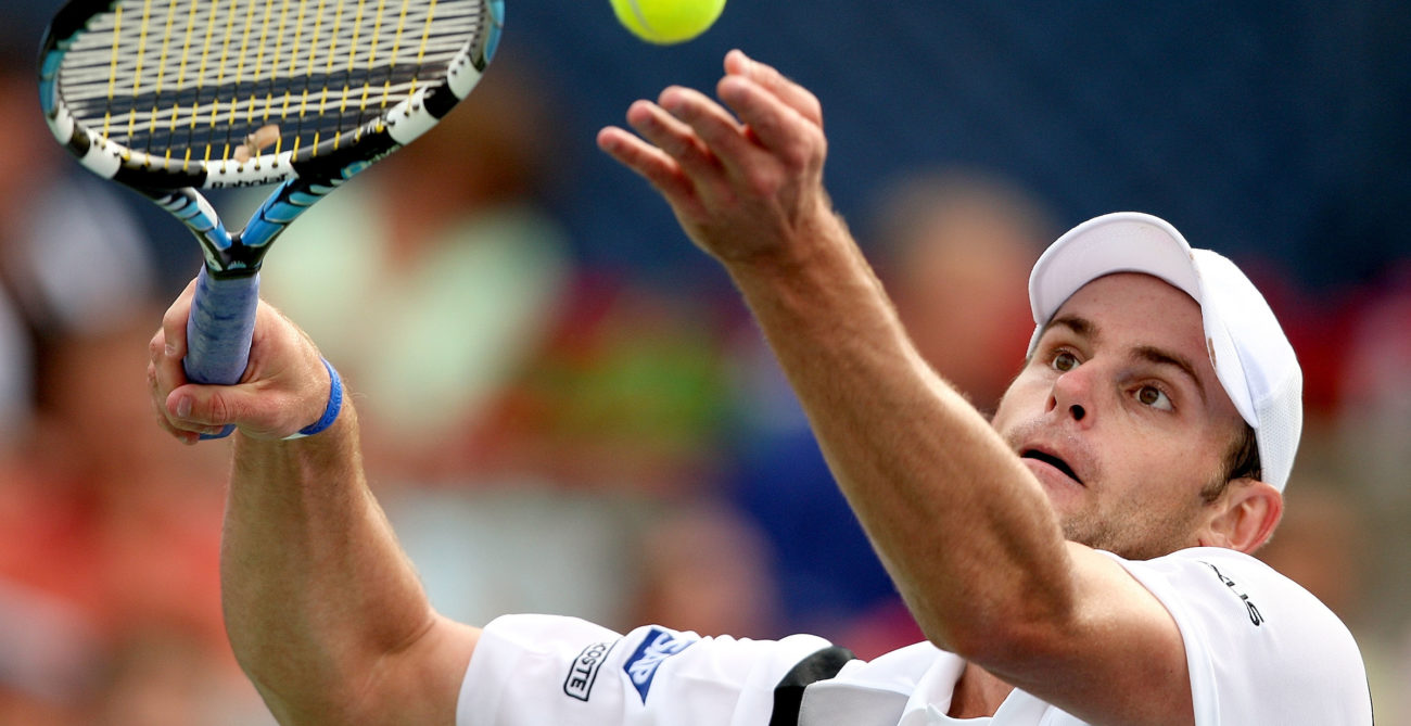 Andy Roddick tosses the ball up to serve