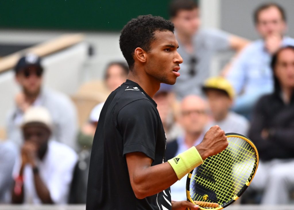 Felix Auger-Aliassime pumps his fist.