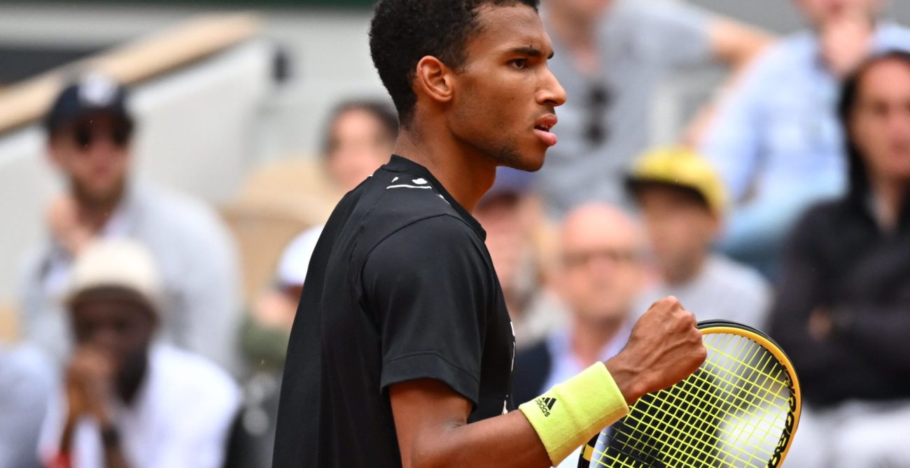 Felix Auger-Aliassime pumps his fist.