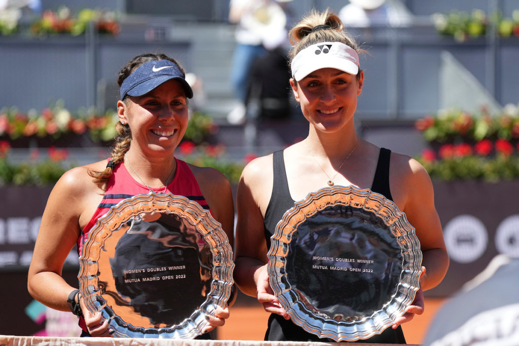 Giuliana Olmos and Gabriela Dabrowski hold their Madrid trophies.