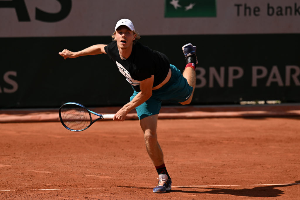 Denis Shapovalov follows through on a serve.