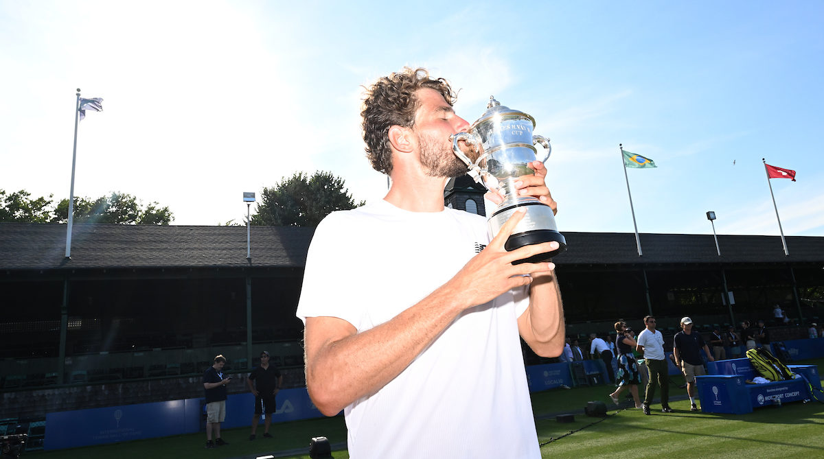 Maxime Cressy kisses the Newport trophy