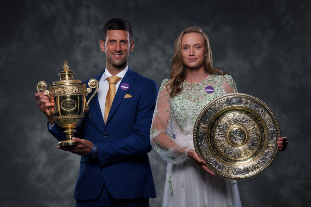Novak Djokovic and Elena Rybakina hold their trophies at the Wimbledon champions dinner.
