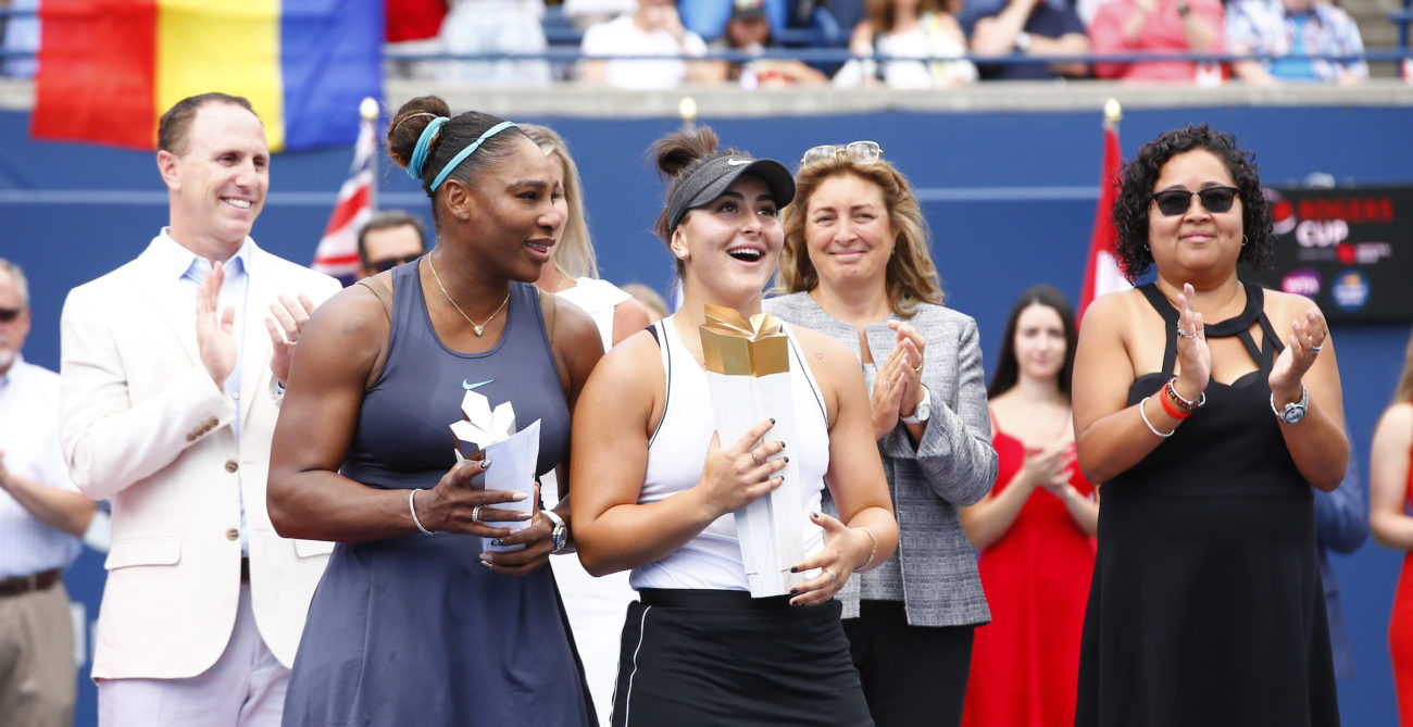 Serena Williams and Bianca Andreescu hold their trophies.