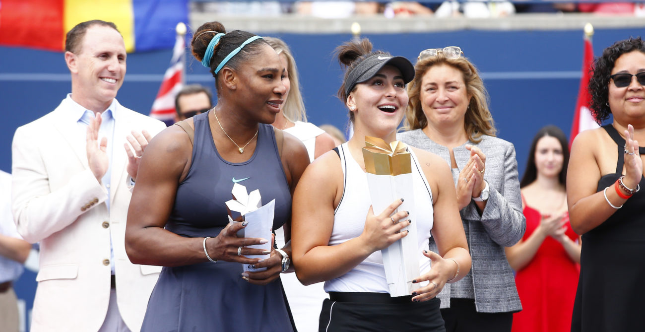 Serena Williams and Bianca Andreescu hold their trophies.