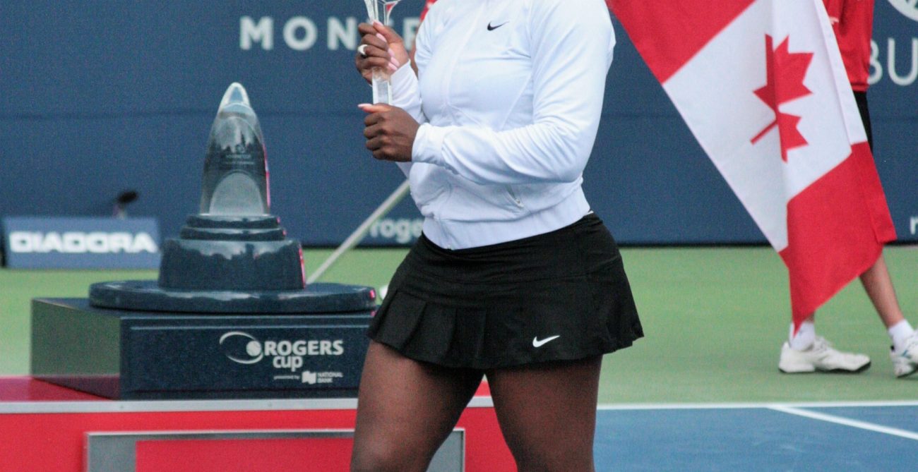 Serena Williams lifts the Rogers Cup trophy.