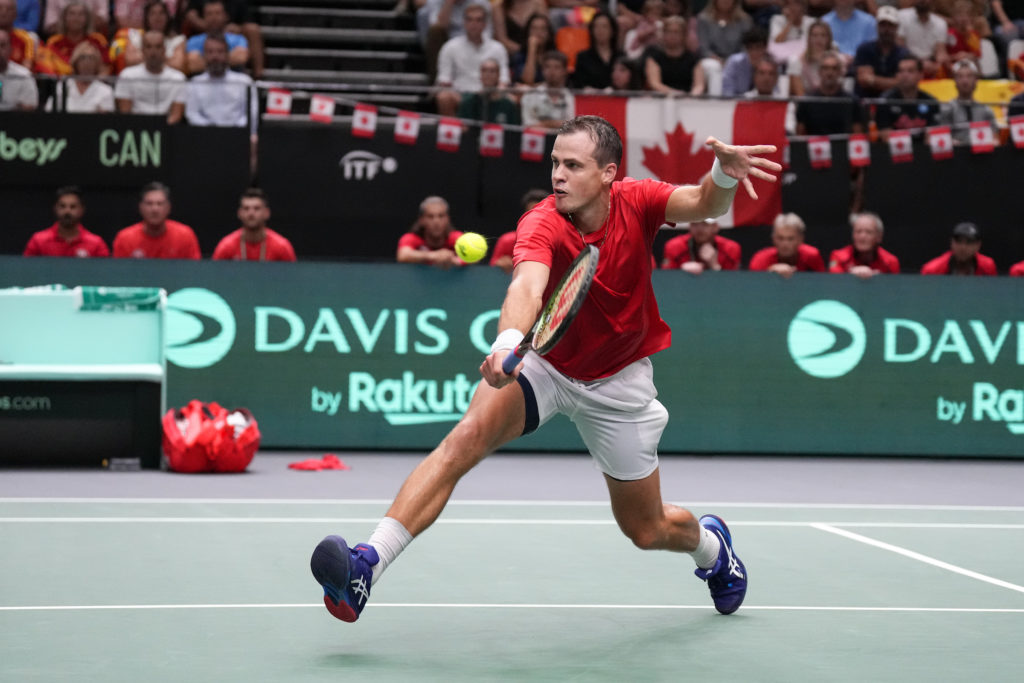 Vasek Pospisil lunges for a volley.