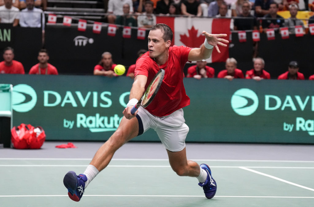 Vasek Pospisil lunges for a volley.