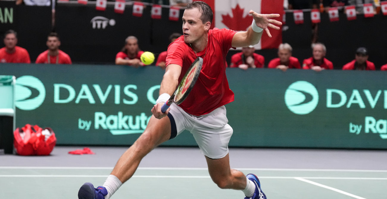 Vasek Pospisil lunges for a volley.