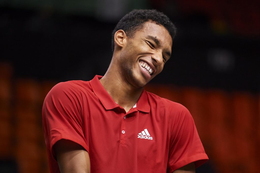 Felix Auger-Aliassime smiles during a practice