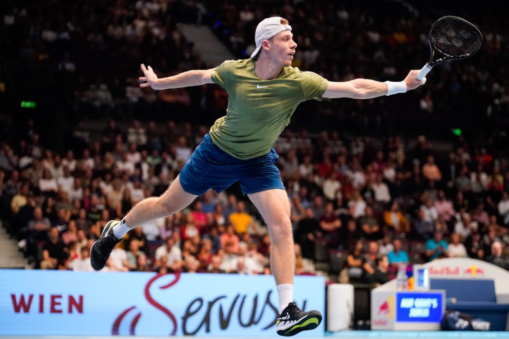 Denis Shapovalov follows through on a backhand.