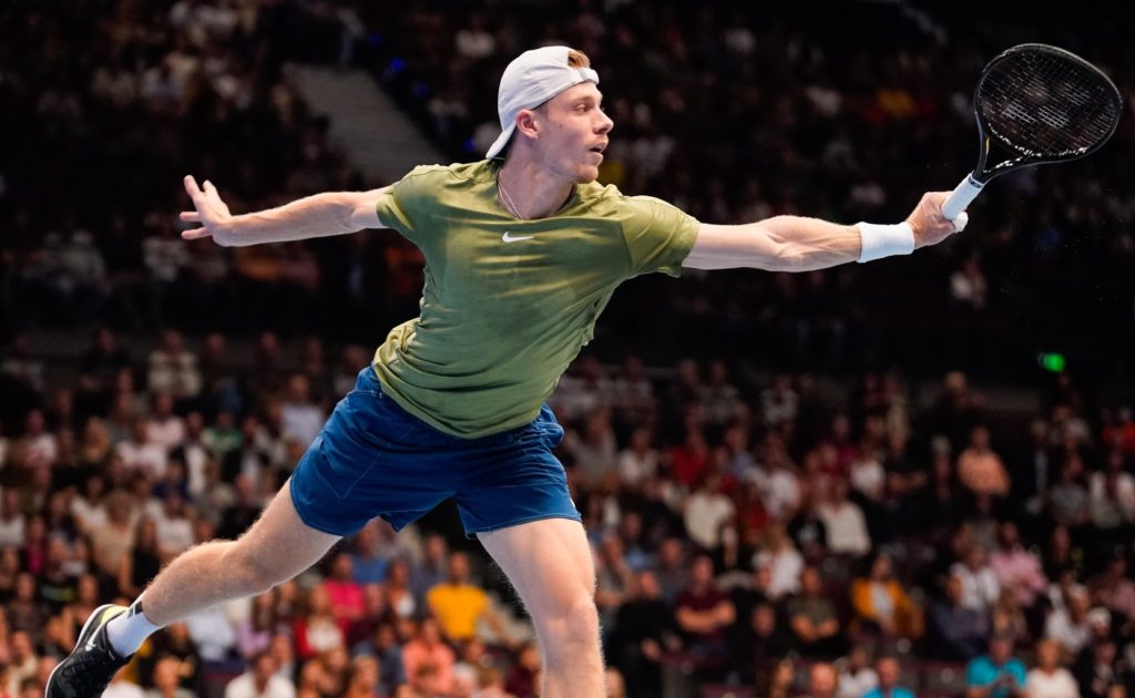 Denis Shapovalov follows through on a backhand.