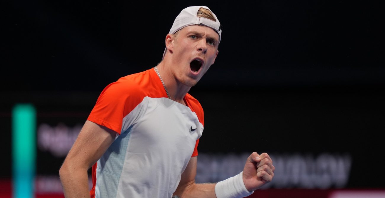 Denis Shapovalov pumps his fist and yells.